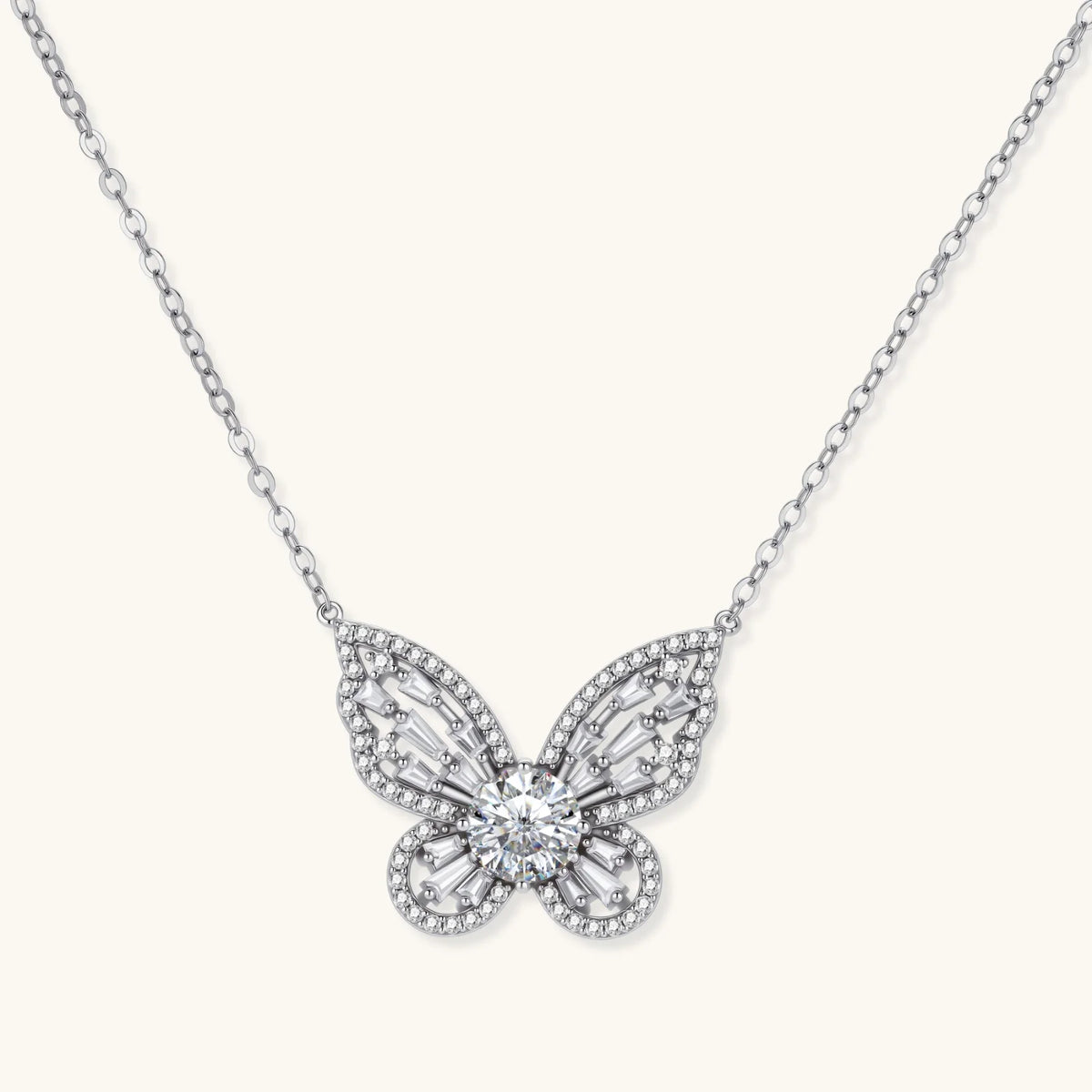 Sterling silver butterfly pendant with radiating design and central moissanite stone on adjustable chain