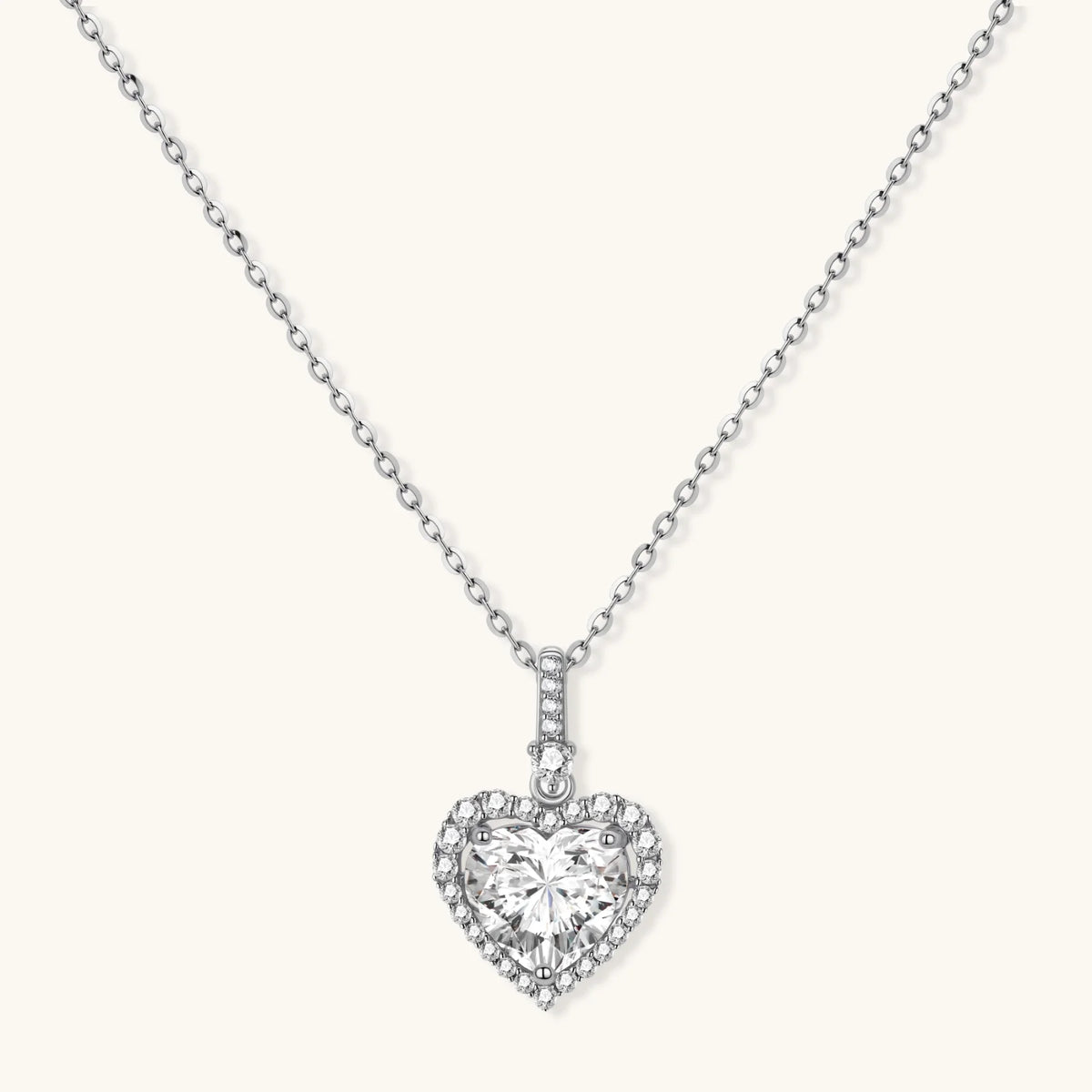 Complete jewelry set with heart-shaped sterling silver pieces featuring brilliant moissanite stones on white background.
