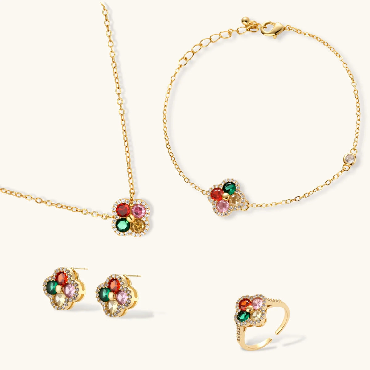 Gold-plated clover jewelry set with red, pink, green and champagne CZ stones surrounded by crystal borders