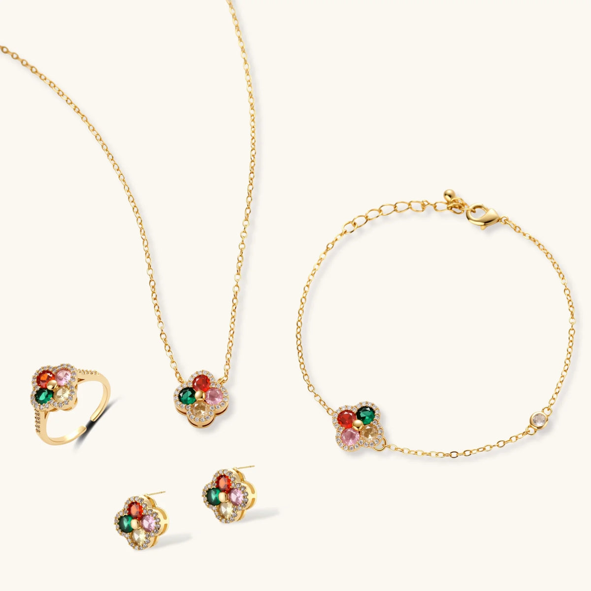 Gold-plated clover jewelry set with red, pink, green and champagne CZ stones surrounded by crystal borders