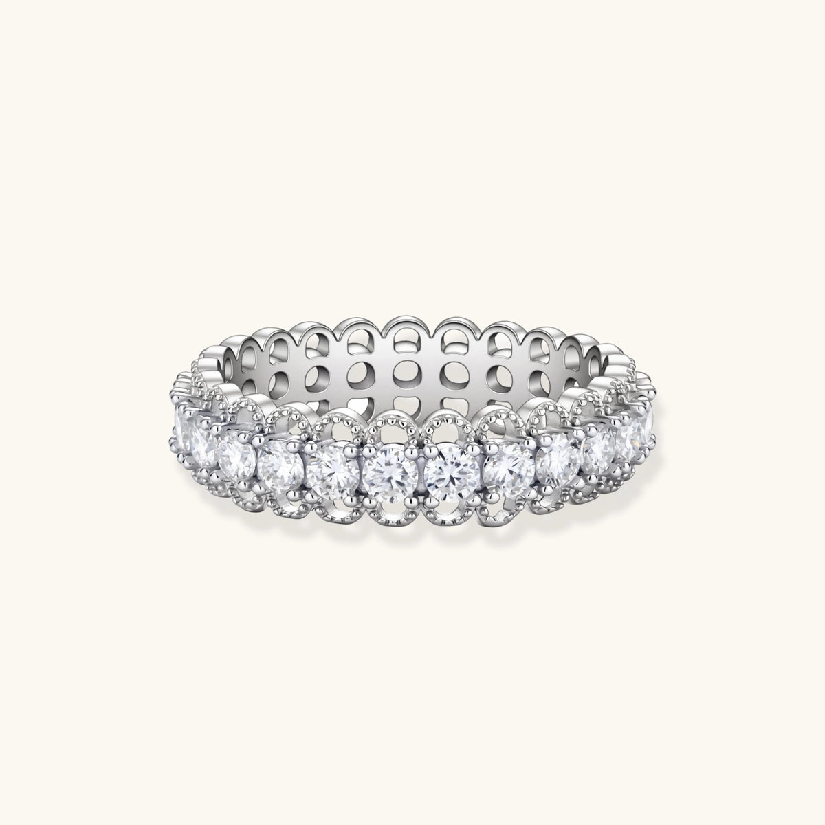 Sterling silver eternity ring with continuous row of brilliant moissanite stones in scalloped crown setting with milgrain detail