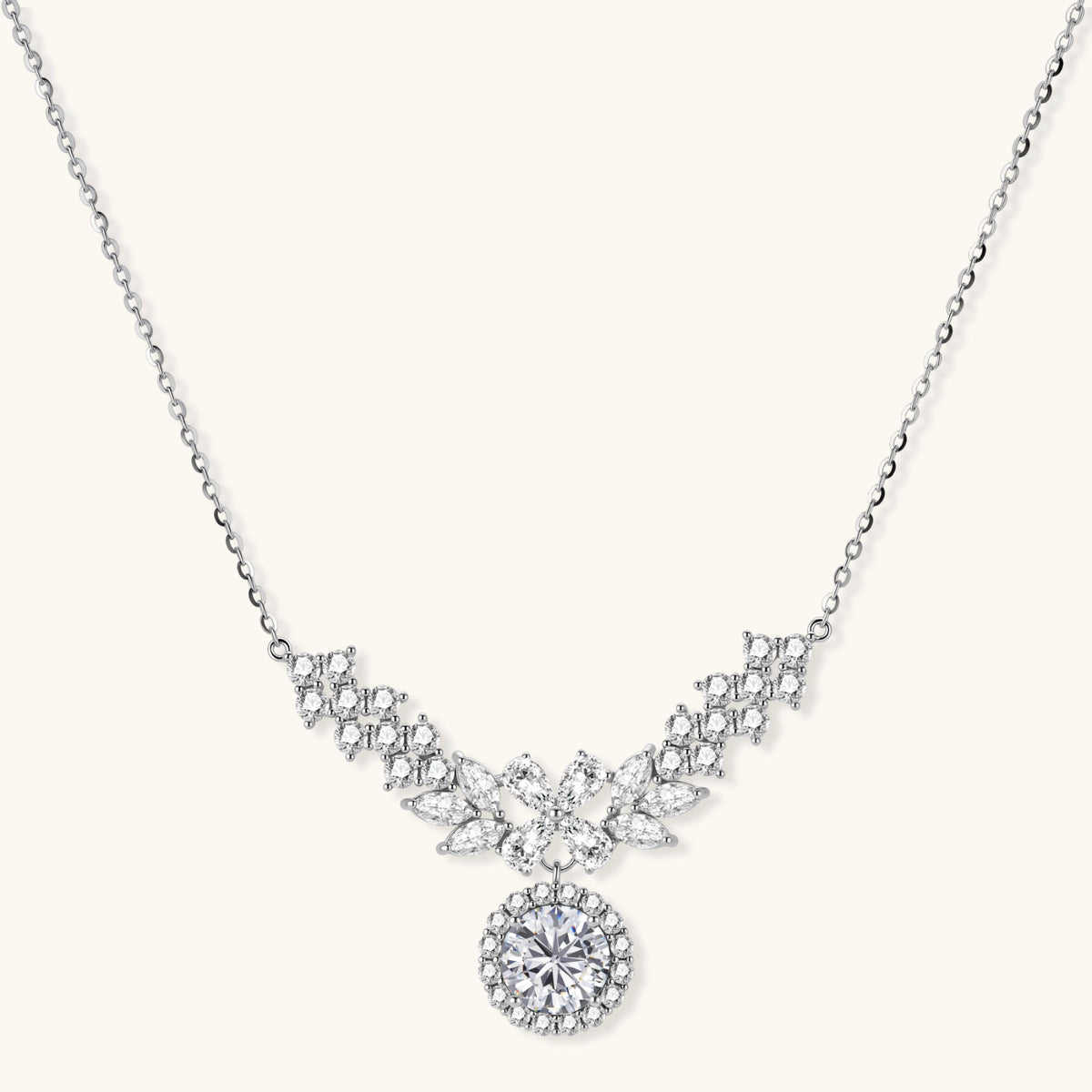 Elegant sterling silver necklace featuring intricate wing-like design with brilliant moissanite stones on neutral background.