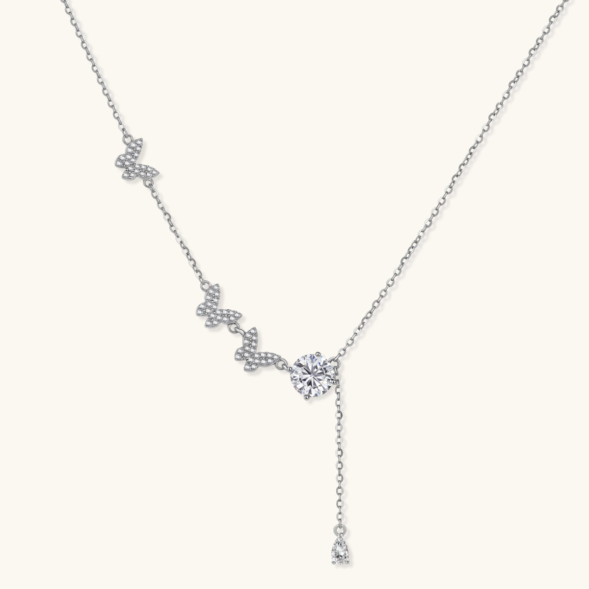 Sterling silver Y-shaped necklace with butterfly charms and brilliant moissanite stone with teardrop pendant
