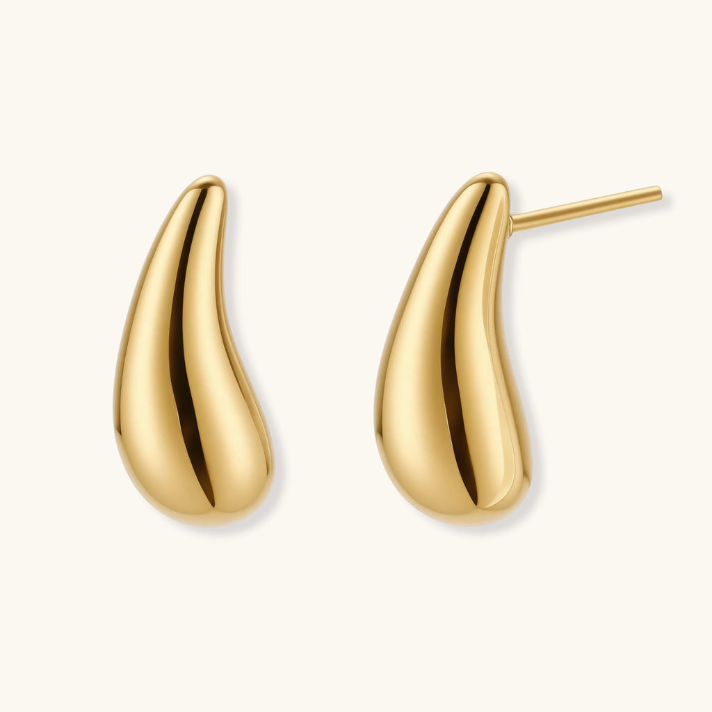 Pair of gold-plated sterling silver teardrop stud earrings with polished finish on white background.