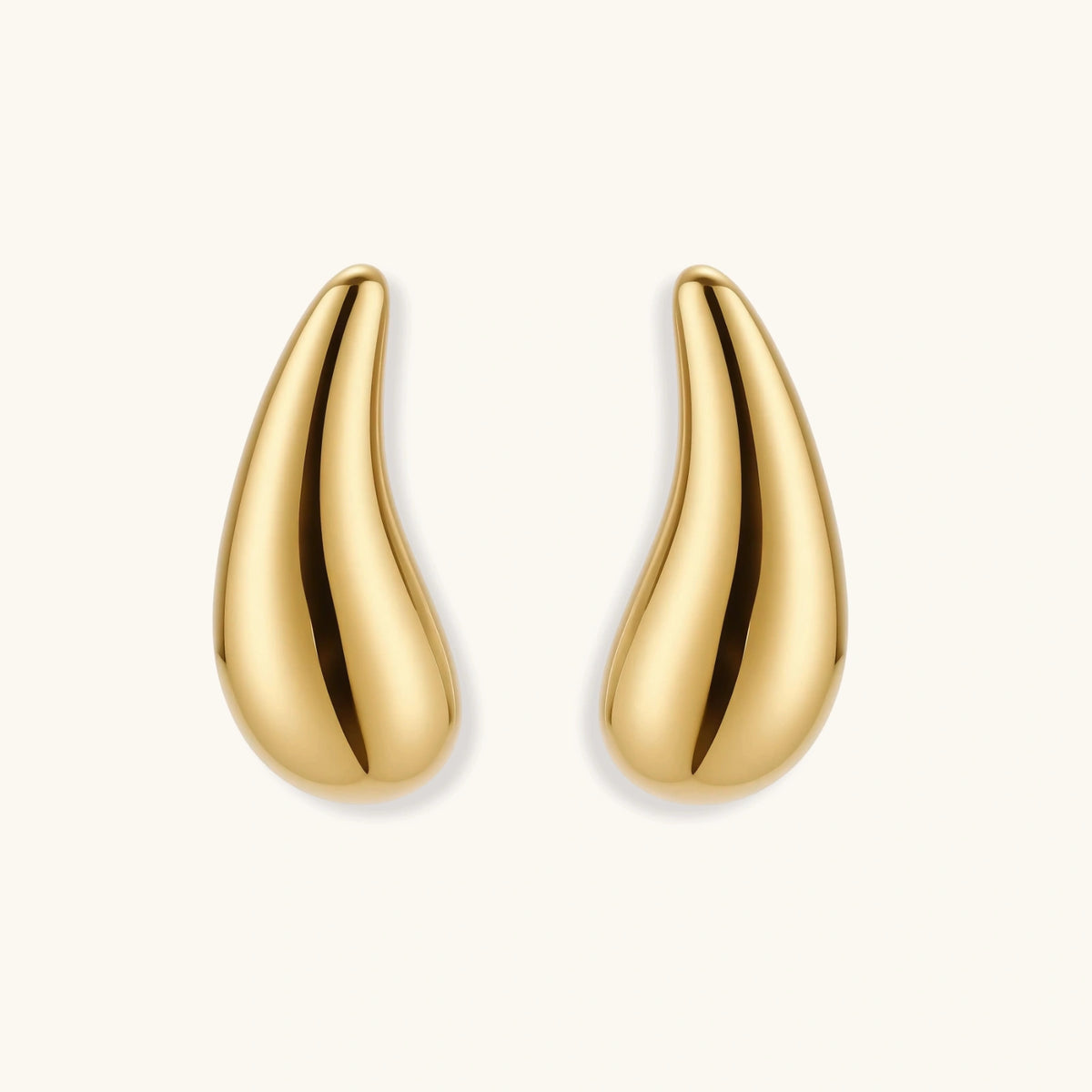 Pair of gold-plated sterling silver teardrop stud earrings with polished finish on white background.