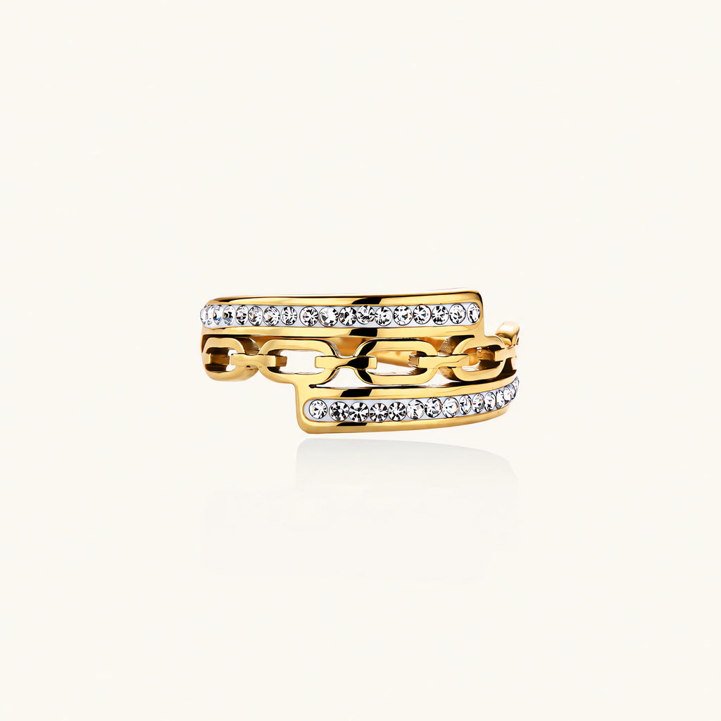 Gold-plated stainless steel ring with geometric chain link design flanked by two rows of clear rhinestones